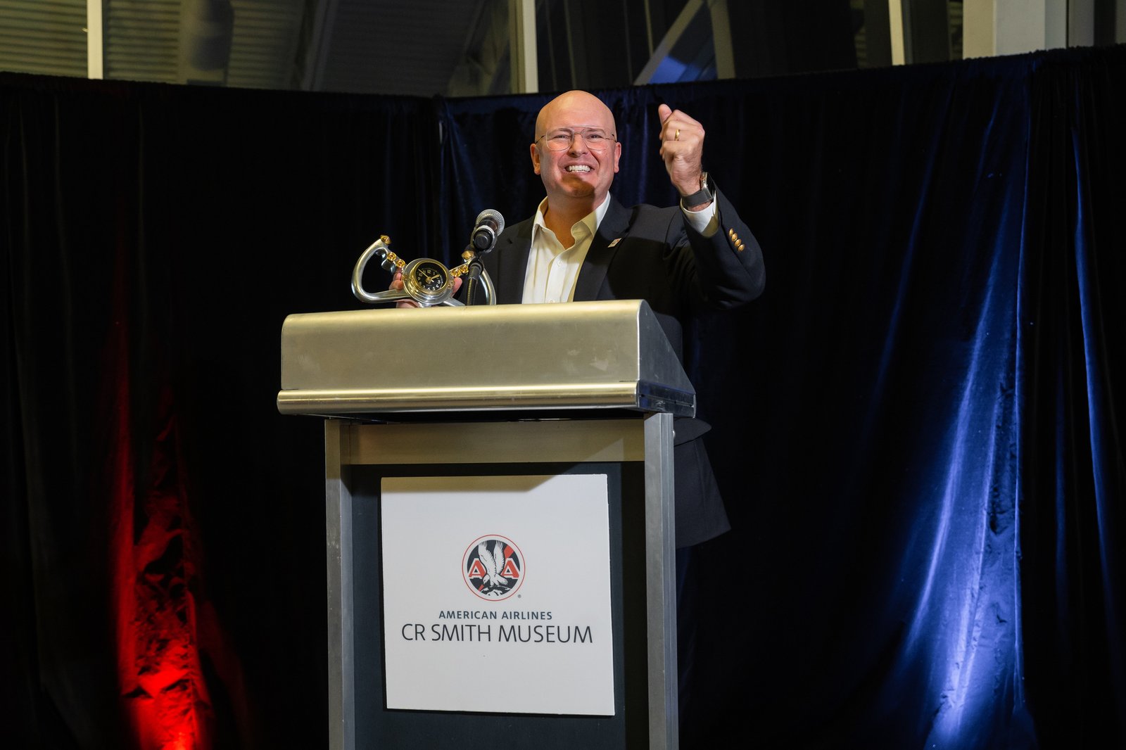 Robert Hausmann celebrating a leadership program milestone at a US company event.