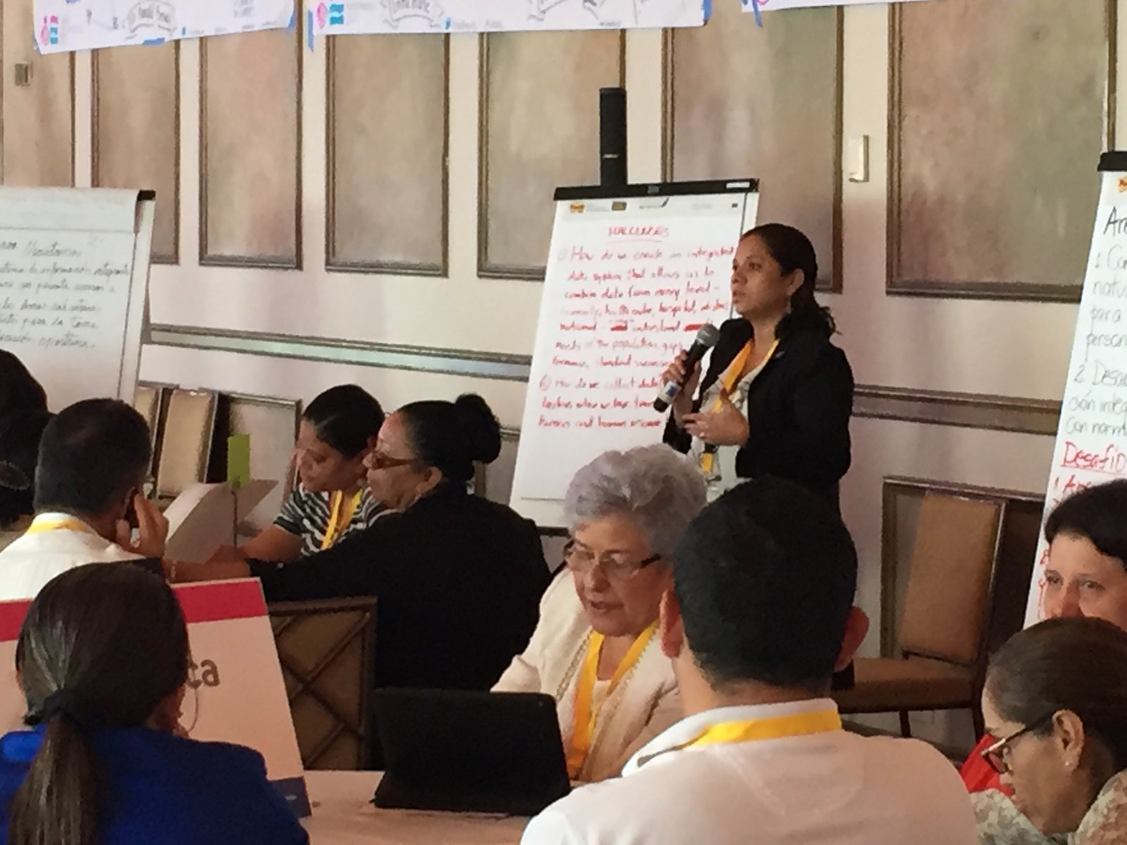 A healthcare leader sharing a participant story during a facilitated convening in Panama.